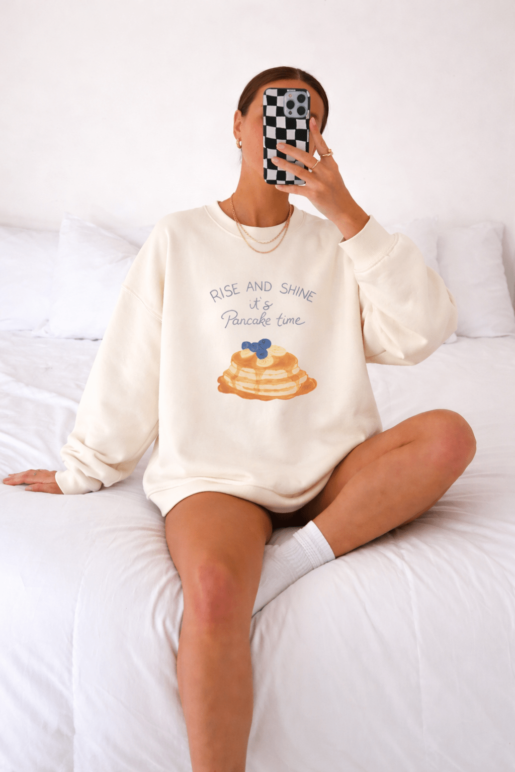 Ivory crewneck sweatshirt with pancake graphic and 'Rise and Shine' text
