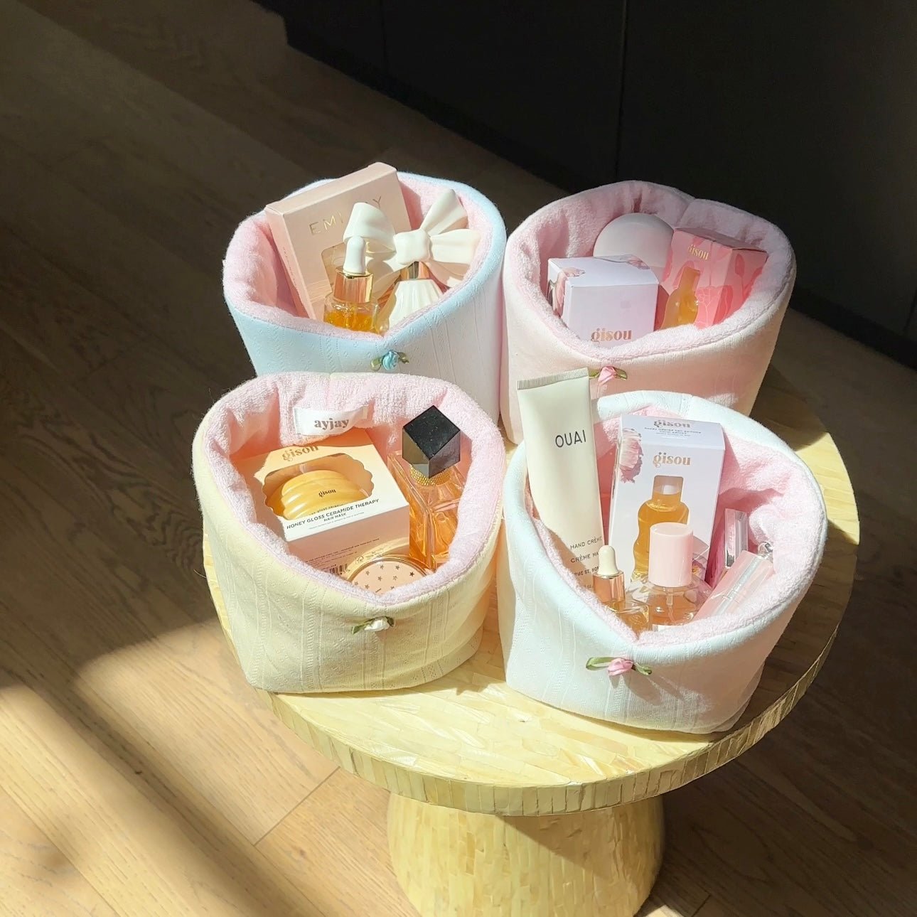 Pastel fabric organizer basket set on table with rounded openings for toiletries