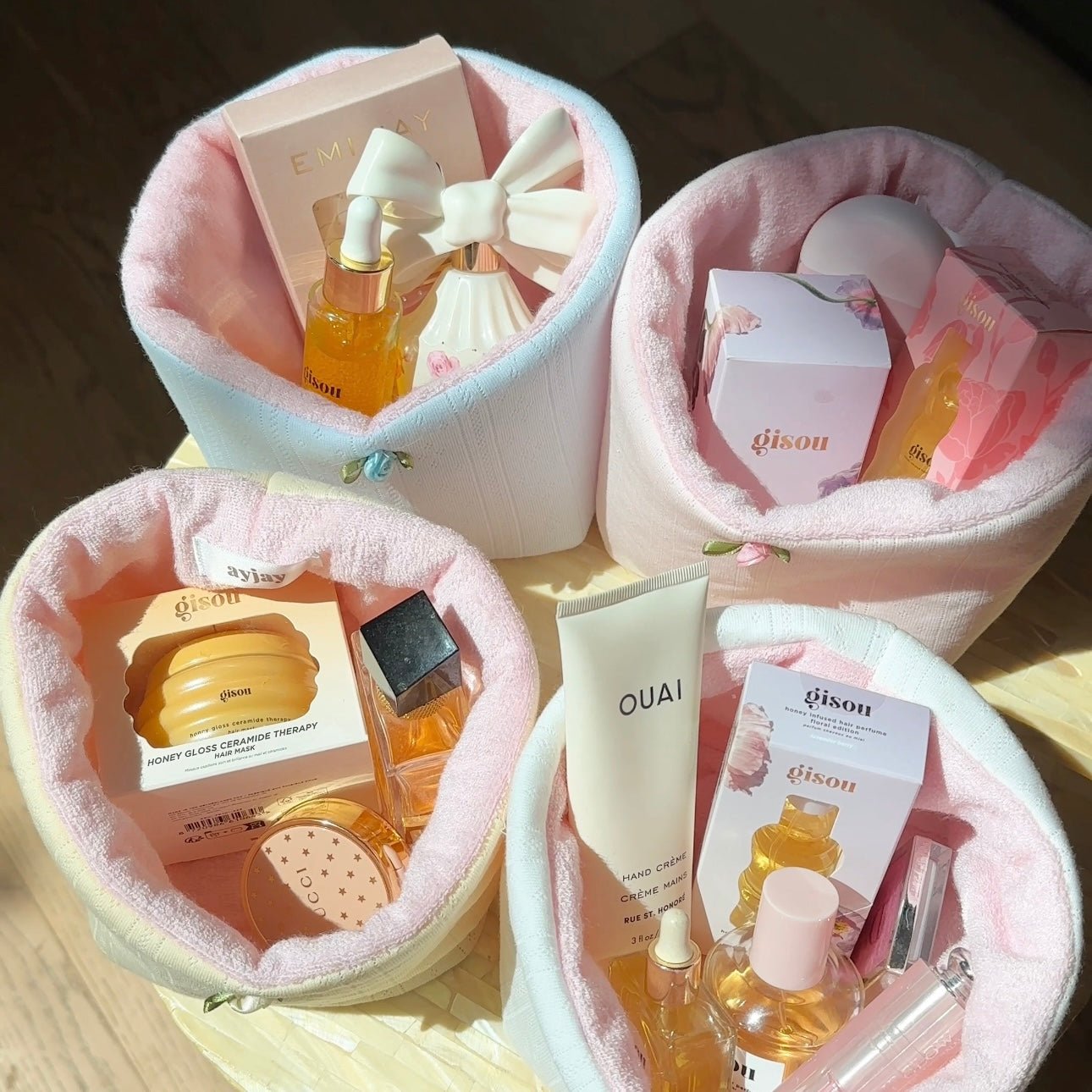 Pastel fabric organizer baskets with wide openings holding skincare boxes and bottles
