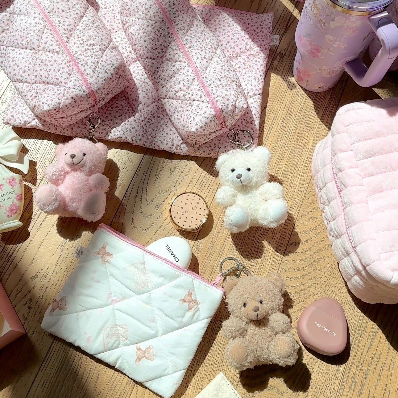 Pink, white, and tan teddy bear plush keychain charms with silver key rings