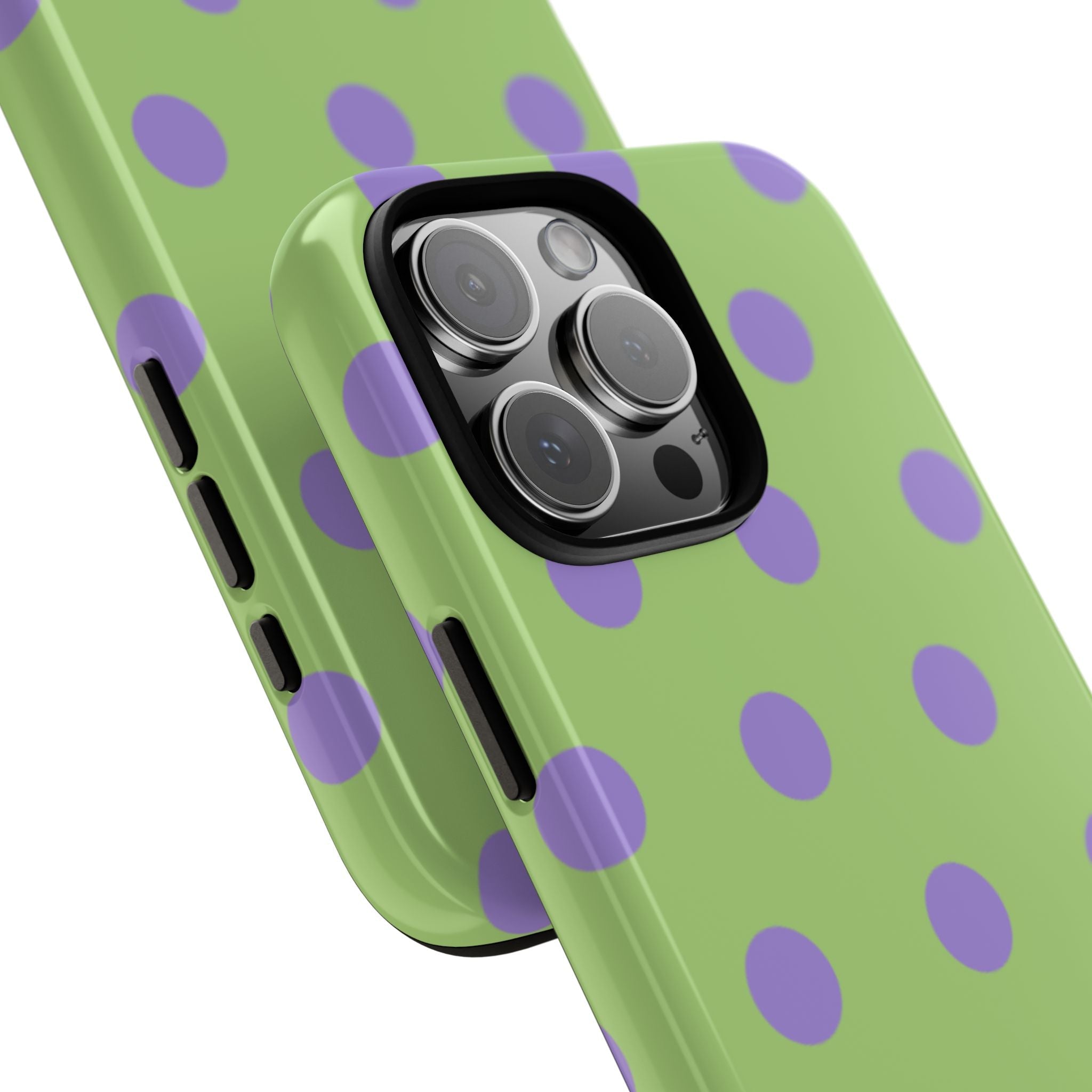 Angled view of light green phone case with lavender polka dots, side buttons cutouts