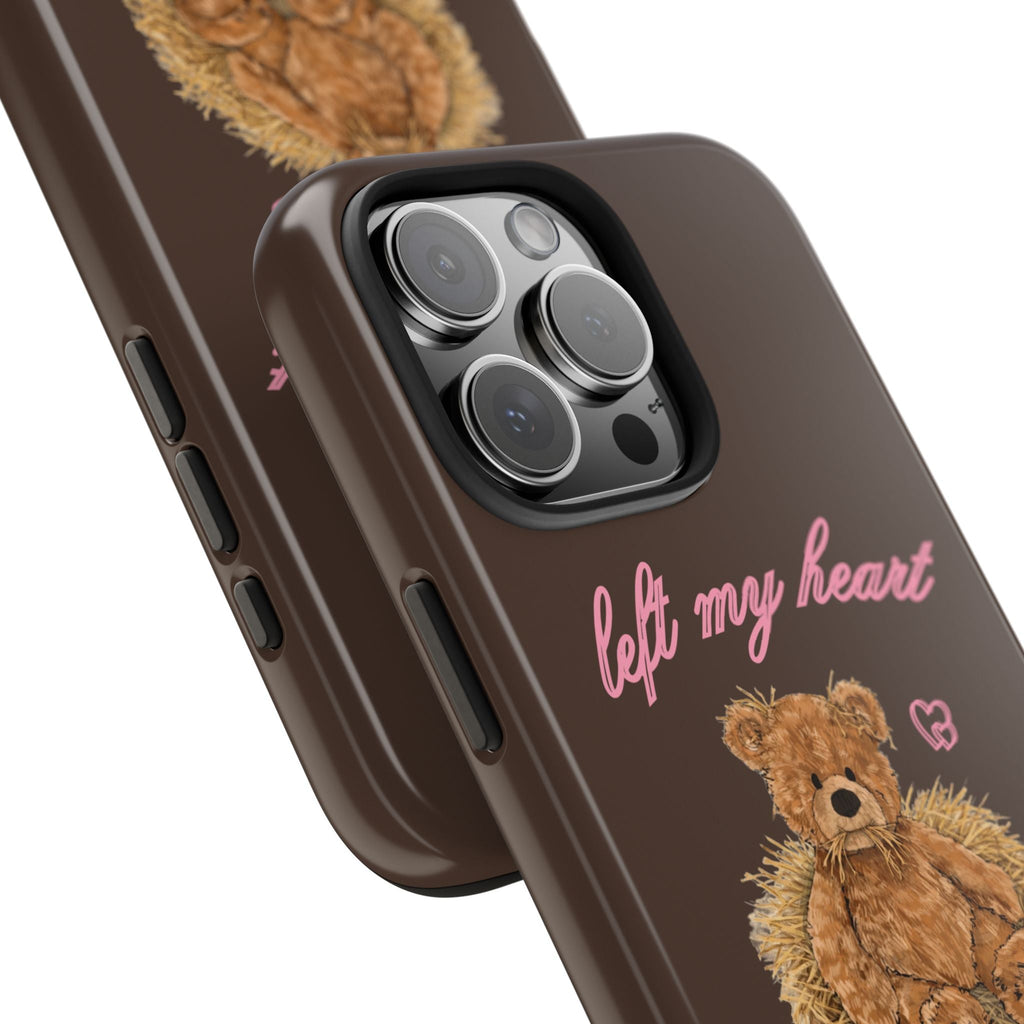 Brown phone case close-up: teddy bear design, pink text, side buttons and camera lenses