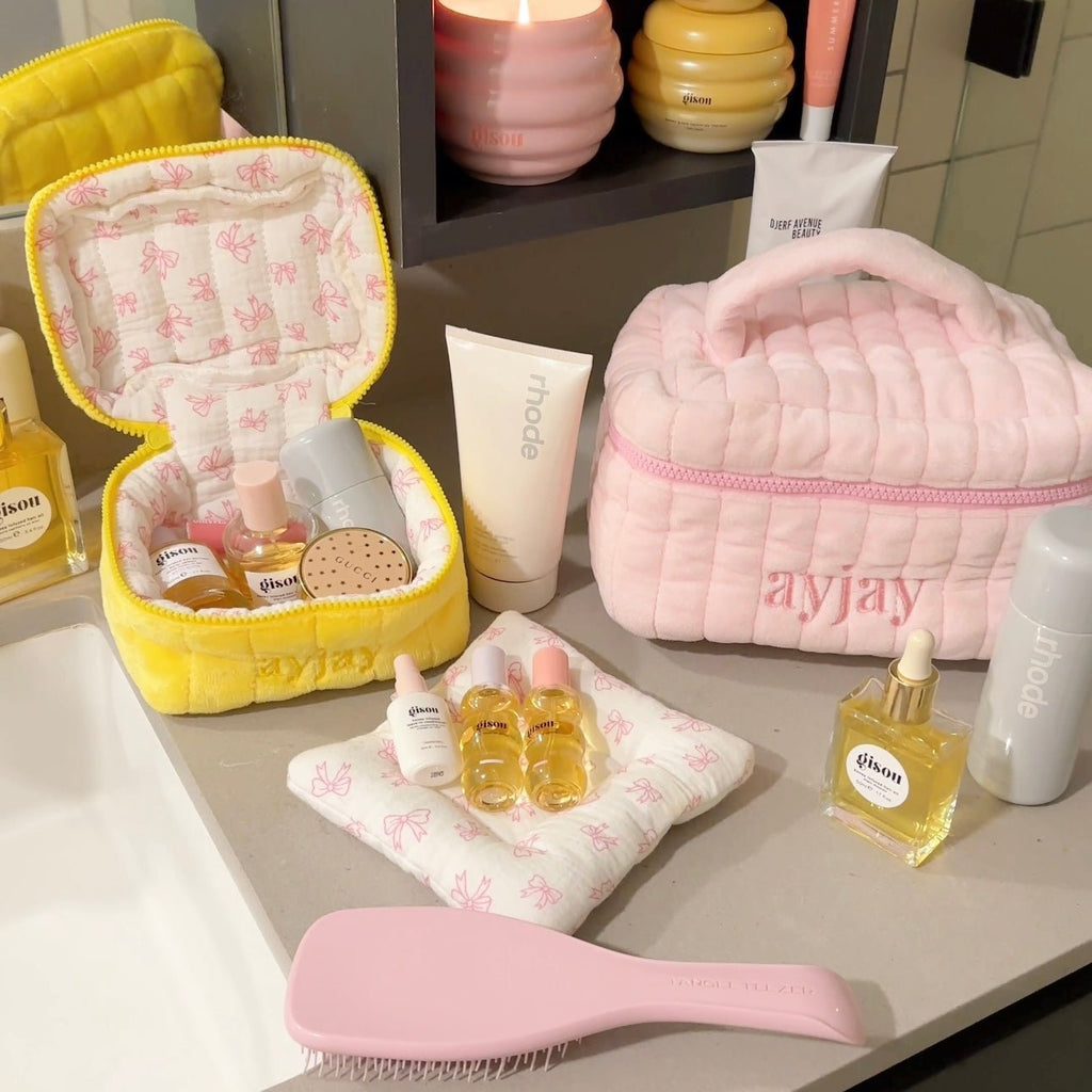 Yellow mini vanity bag open with butterfly print lining and small perfume bottles