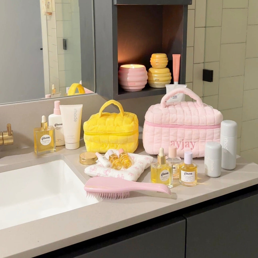 Yellow mini vanity bag with bow handle, plush exterior and butterfly print lining