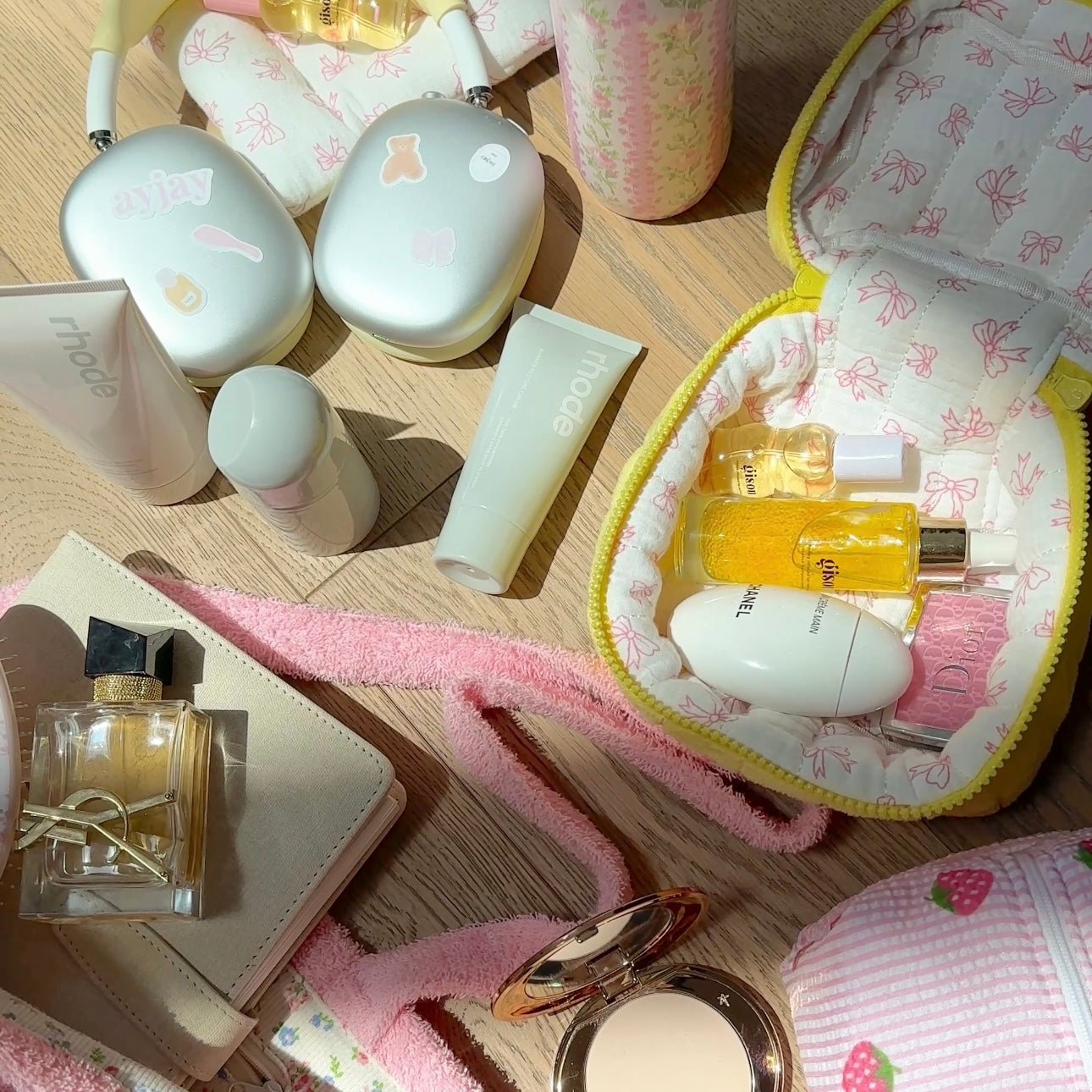 Open yellow mini vanity bag with butterfly print lining, yellow zipper edge and bow