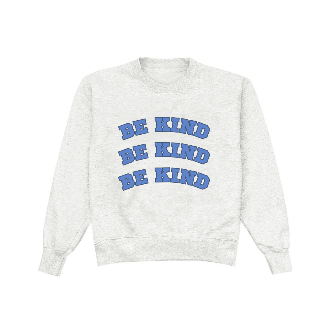 Light gray crewneck sweatshirt with stacked blue “BE KIND” graphic text
