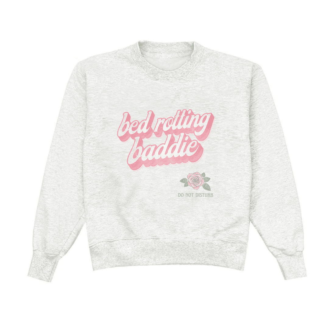 Light gray crewneck sweatshirt, pink 'bed rotting baddie' logo and rose, do not disturb