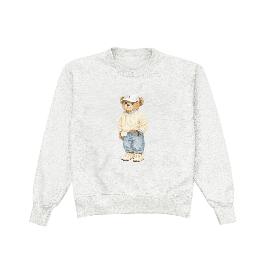 Light gray crewneck sweatshirt front, teddy bear graphic in knit sweater and denim overalls