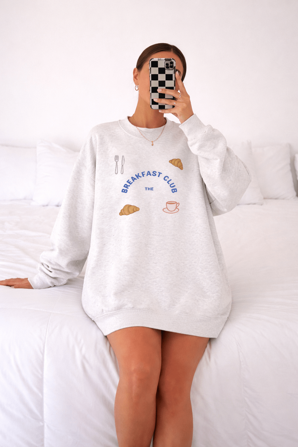 Light gray crewneck sweatshirt with “Breakfast Club” graphic and breakfast icons