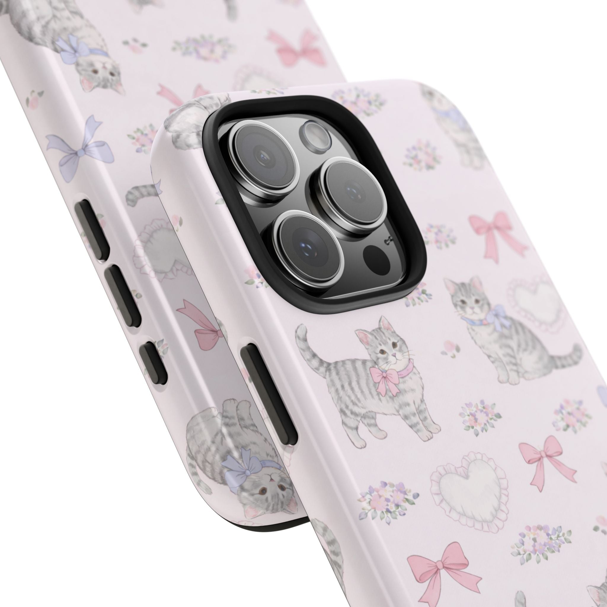 Light pink phone case corner view with coquette cats, bows, and heart motifs