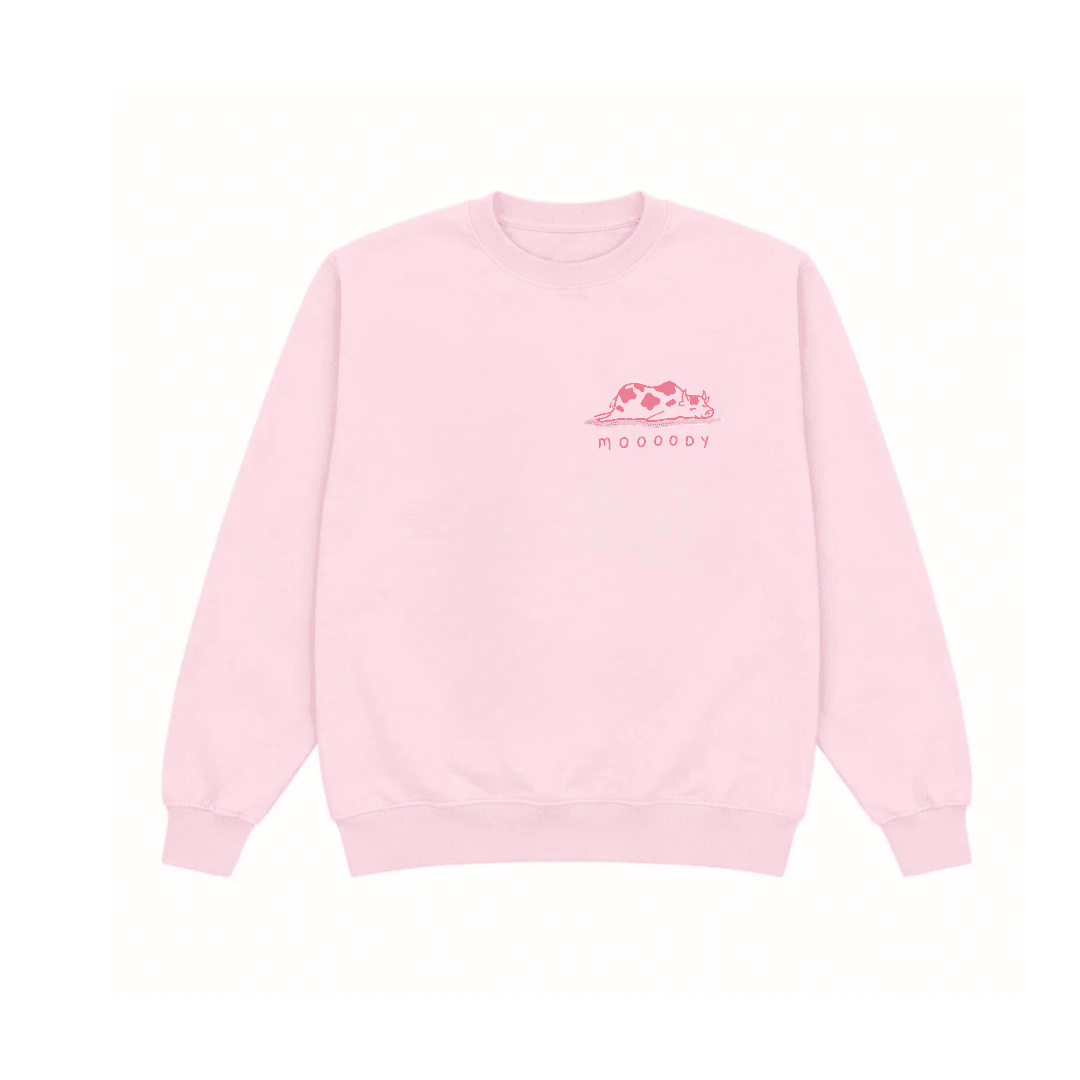 Light pink crewneck sweatshirt, long sleeves, small pink cow logo at chest