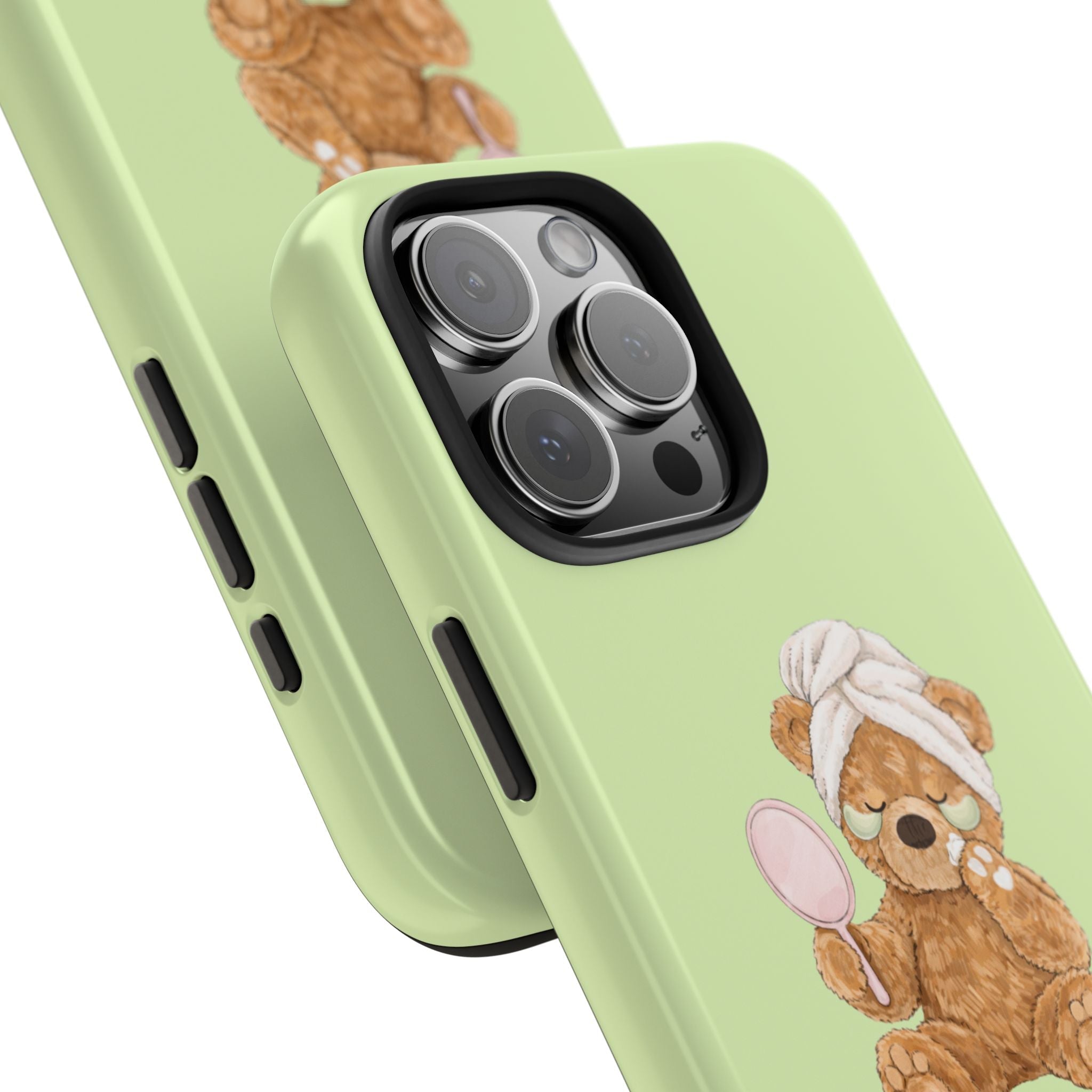 Lime green phone case corner closeup with resting bear face graphic