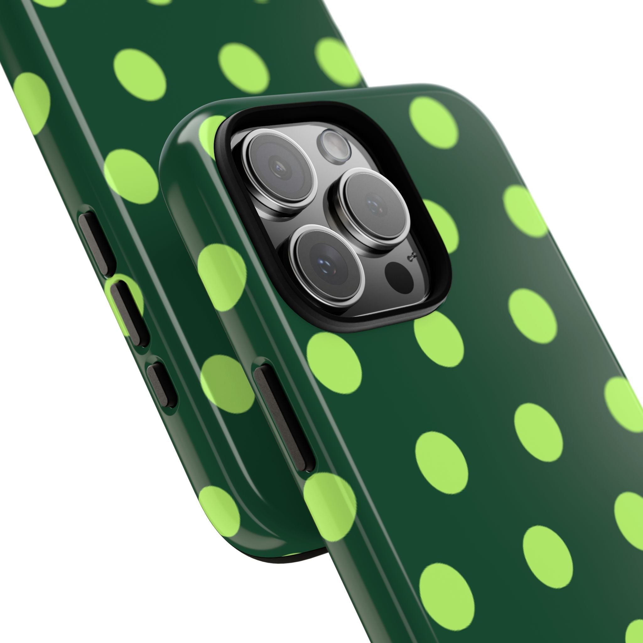 Close-up of dark green phone case corner with lime green polka dots and camera cutout