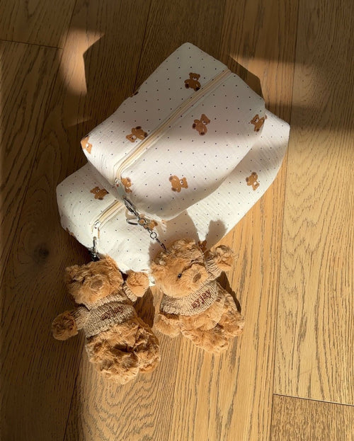 Cream teddy bear print zip pouch with two-tone teddy keychain accents