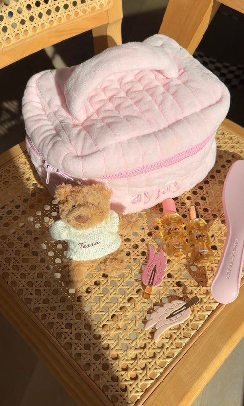 Pink-and-brown teddy bear bag charm keychain with white sweater and embroidered name