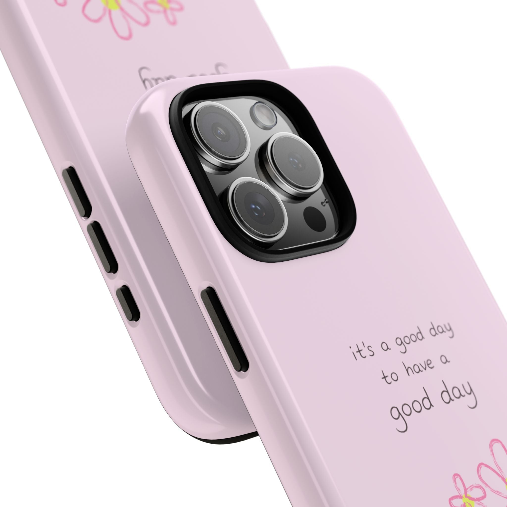 Pink phone case close-up: camera cutout, side buttons, and “good day” lettering