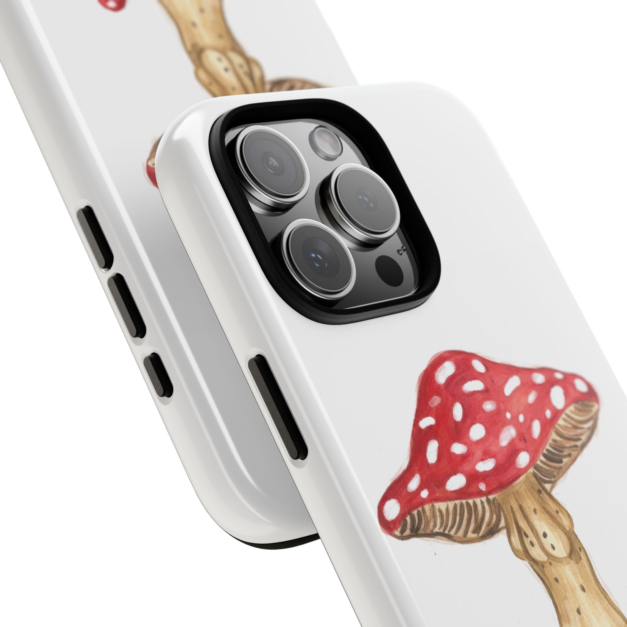 Angled close-up of white phone case with red mushroom illustration near camera