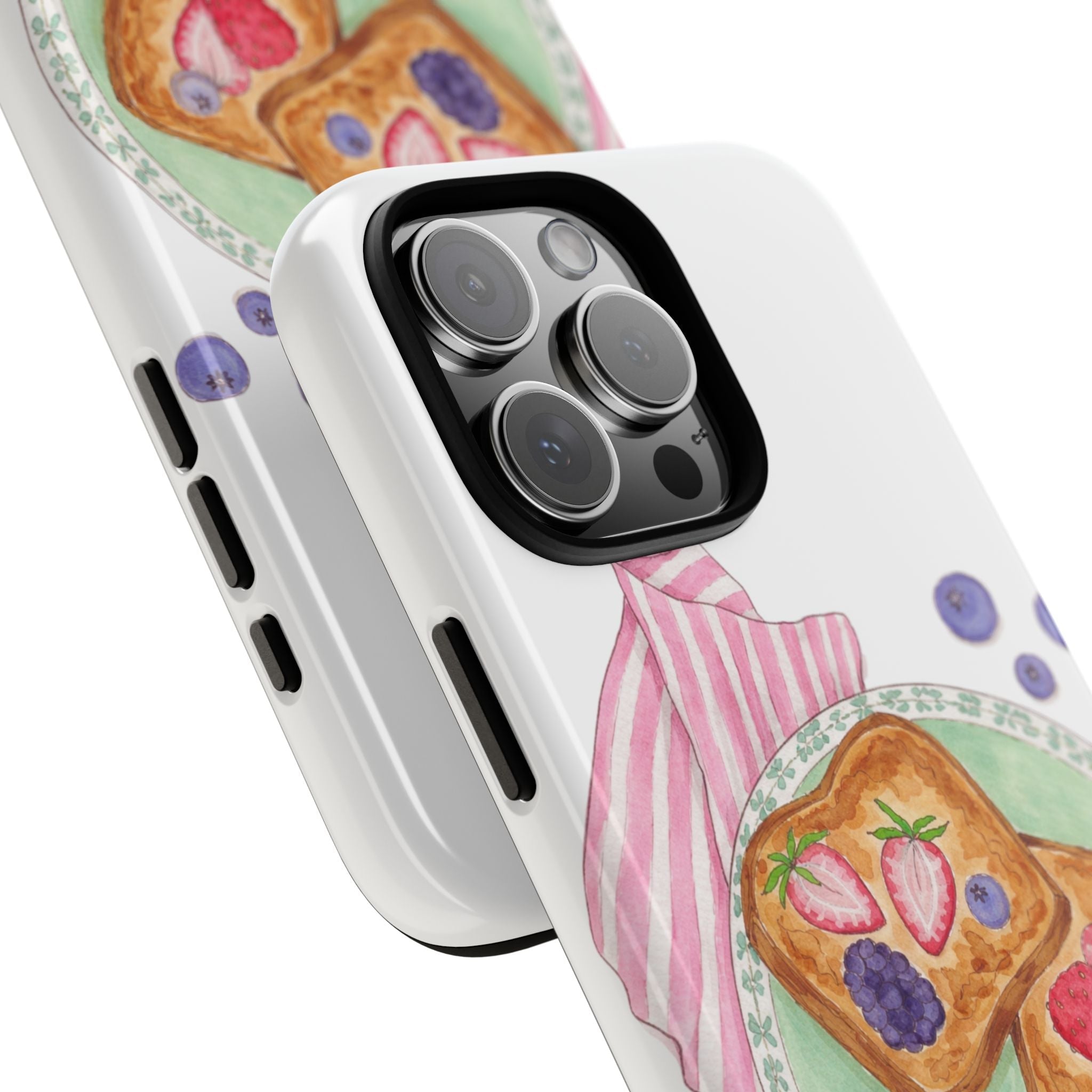 Close-up: white phone case with berry toast graphic around camera cutouts