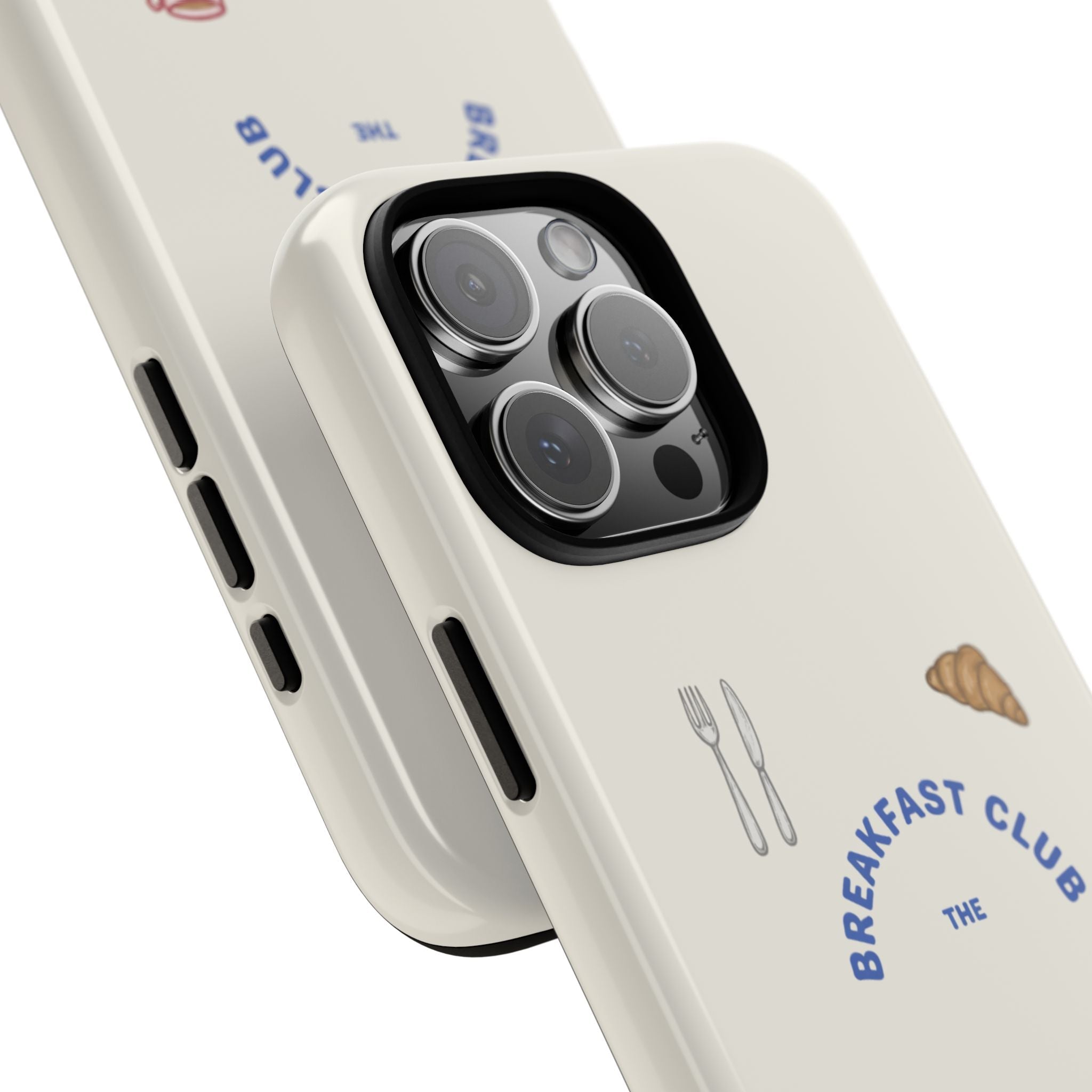 Close-up of white phone case corner with camera lens openings and Breakfast Club artwork.