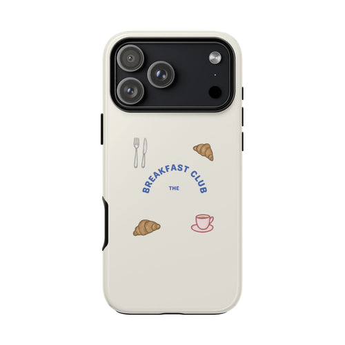 White phone case with “Breakfast Club” text and breakfast icons; camera cutouts visible.