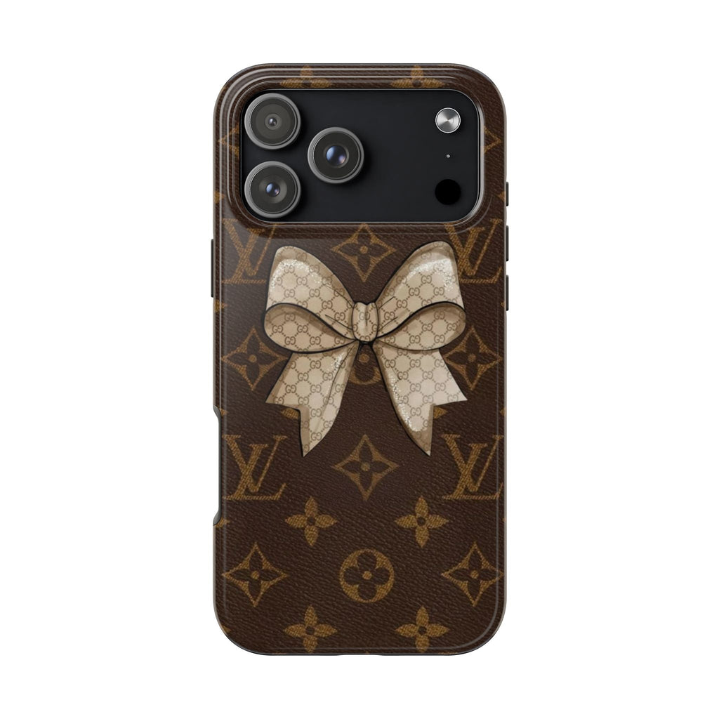 Brown monogram phone case with large cream bow and knot on the back