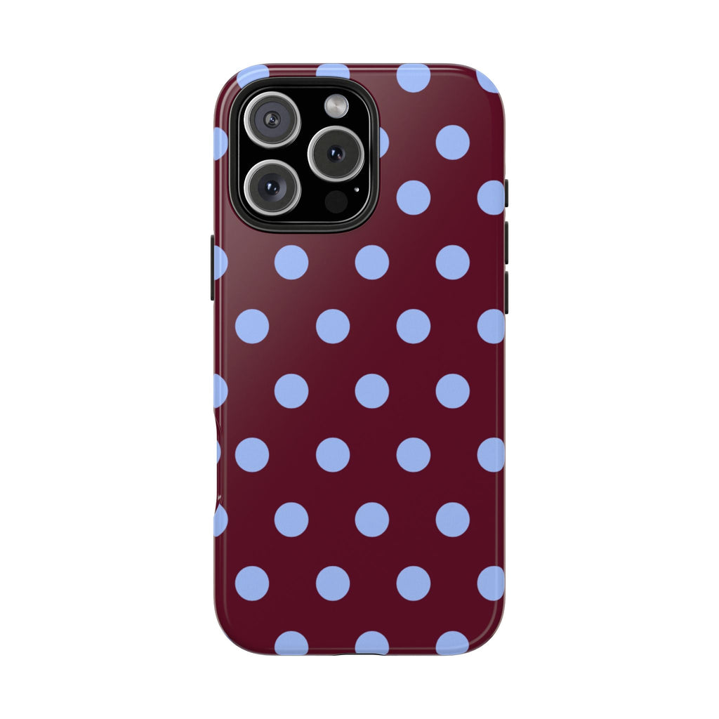 Maroon phone case with light blue polka dots and raised camera cutout