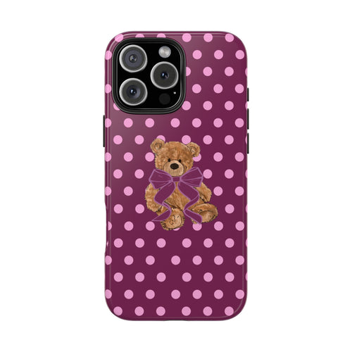 Magenta polka dot phone case featuring a teddy bear with a purple bow