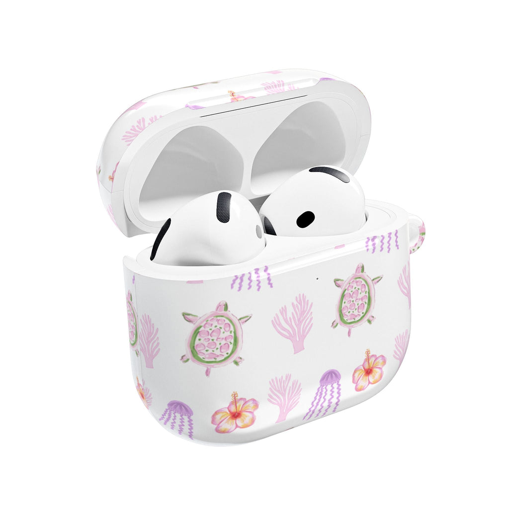Coastline AirPods case with sea turtles, coral and flowers; earbuds inside