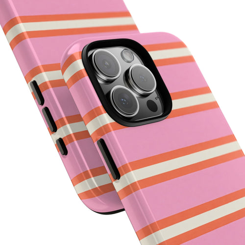 Phone case with pink striped design and lens cutouts, shown from angled close-up