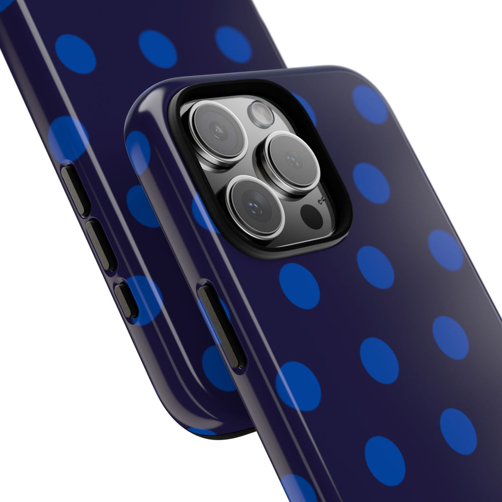 Close-up polka dot phone case with raised camera lenses and shiny edge