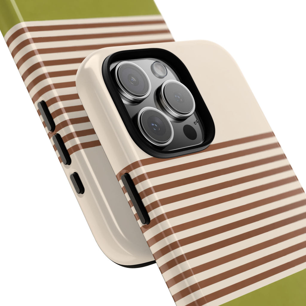 Angled view of matcha latte striped phone case with horizontal brown stripes and green bottom