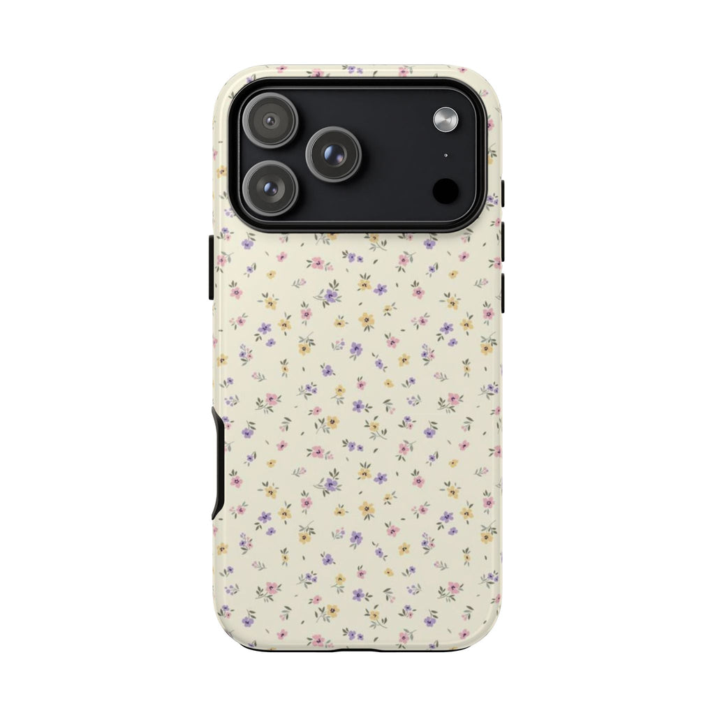 Back of cream ditsy meadow floral phone case showing triple camera cutout and flash