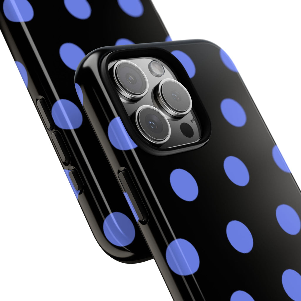 Blue polka dot phone case closeup with camera lenses on black back