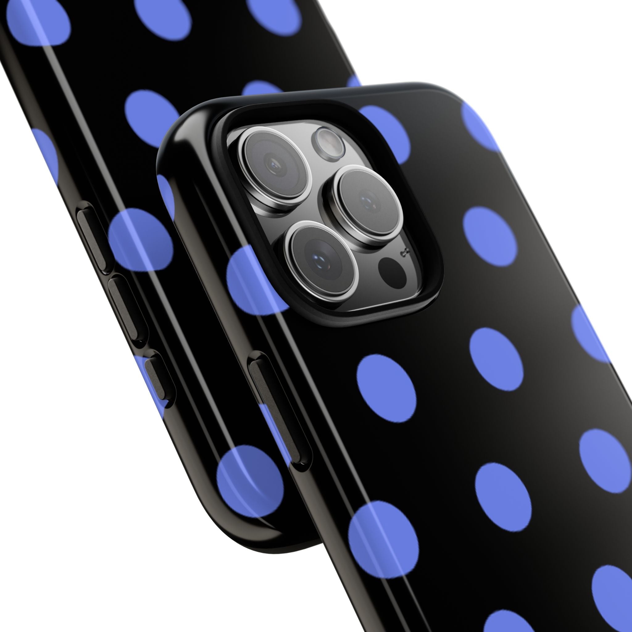 Blue polka dot phone case closeup with camera lenses on black back