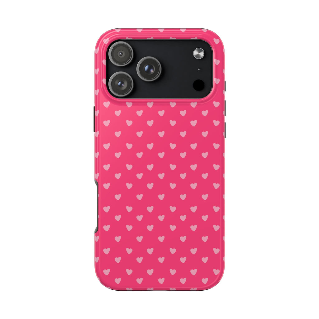 Pink phone case with repeating hearts pattern and dark camera panel; smooth edges