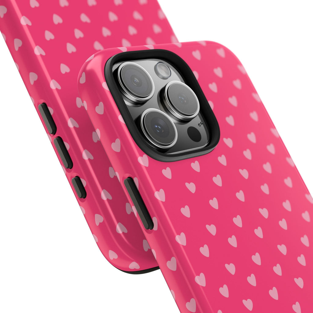 Pink heart-print phone case with side buttons and camera bump; protective cutouts