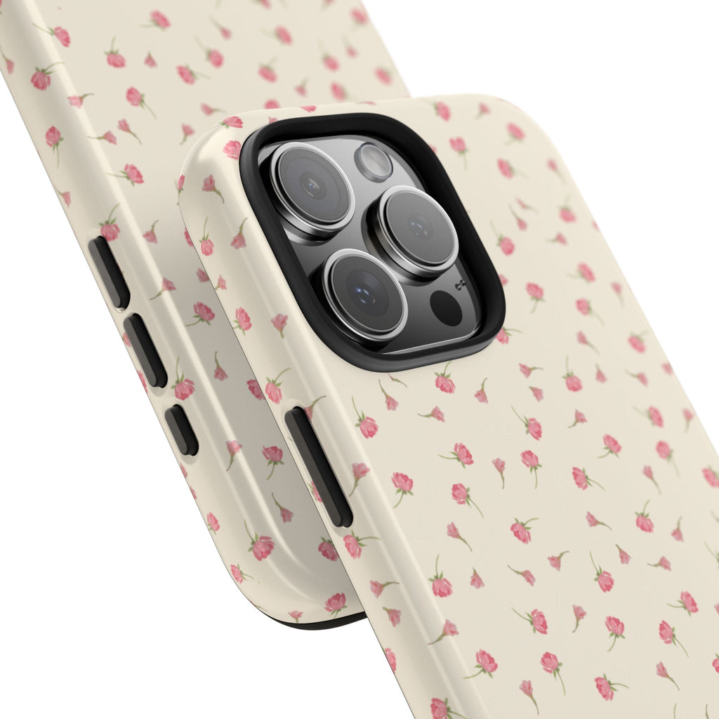Angle close-up of cream phone case with pink ditsy flowers, black camera ring cutouts