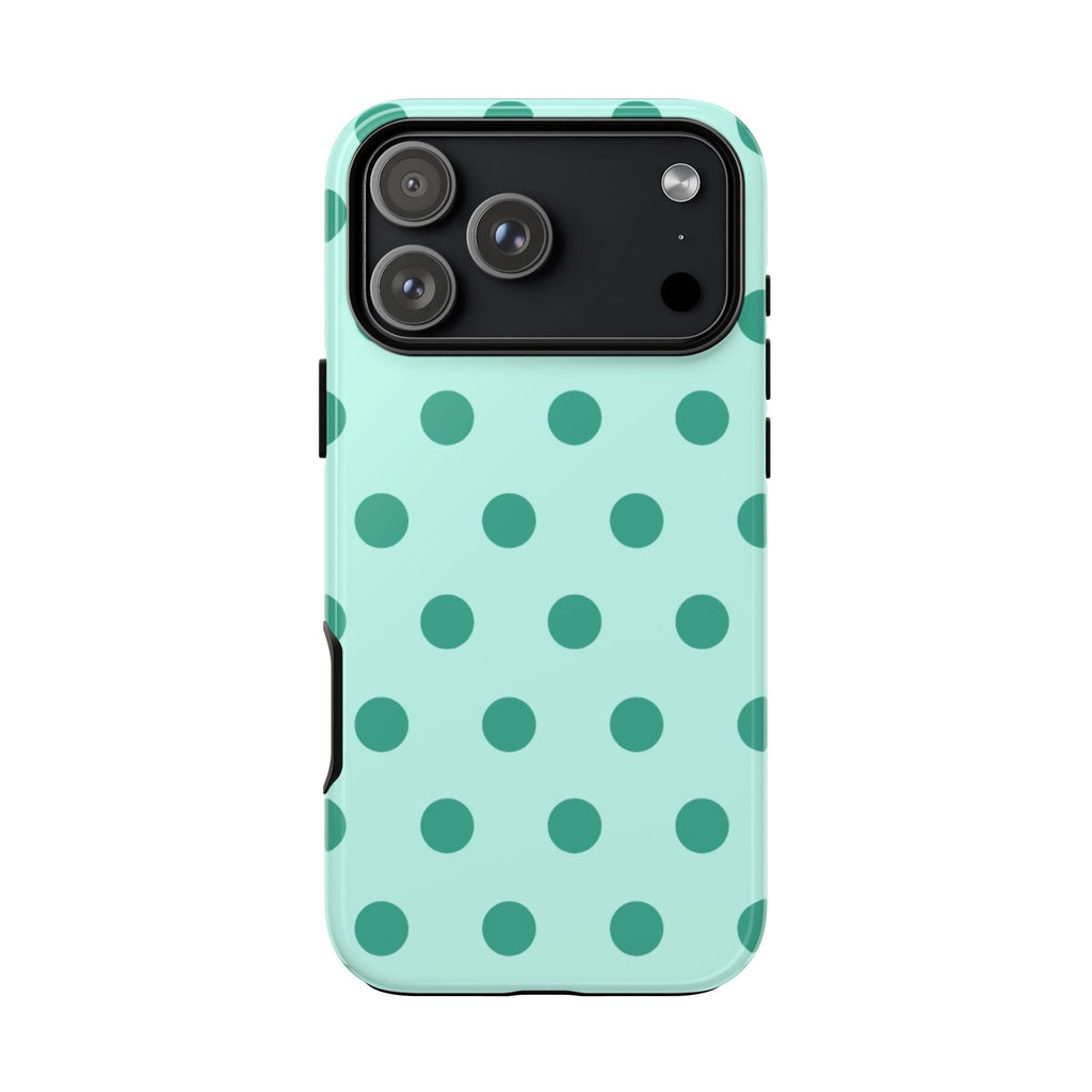 Mint phone case with green polka dots, showing camera cutout and side openings.