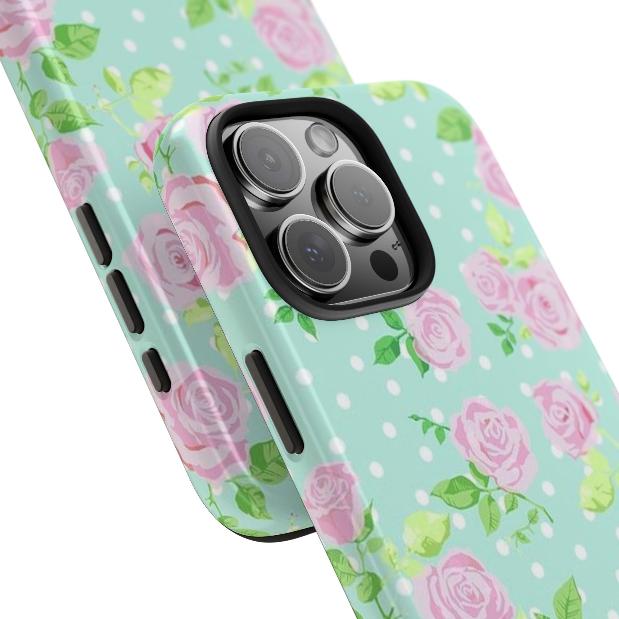 Close-up of mint phone case with pink roses and white polka dots near camera lenses