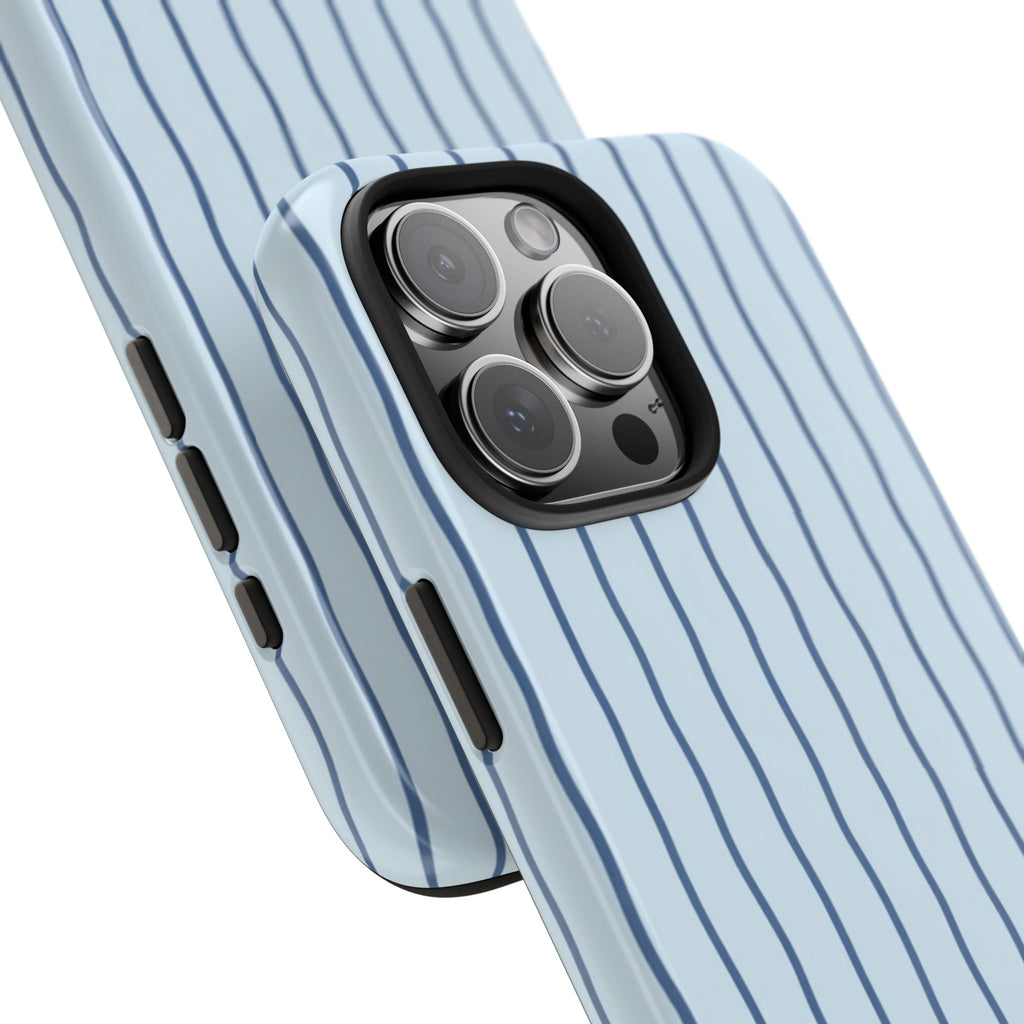 Light-blue phone case with navy vertical stripes, angled view of camera area
