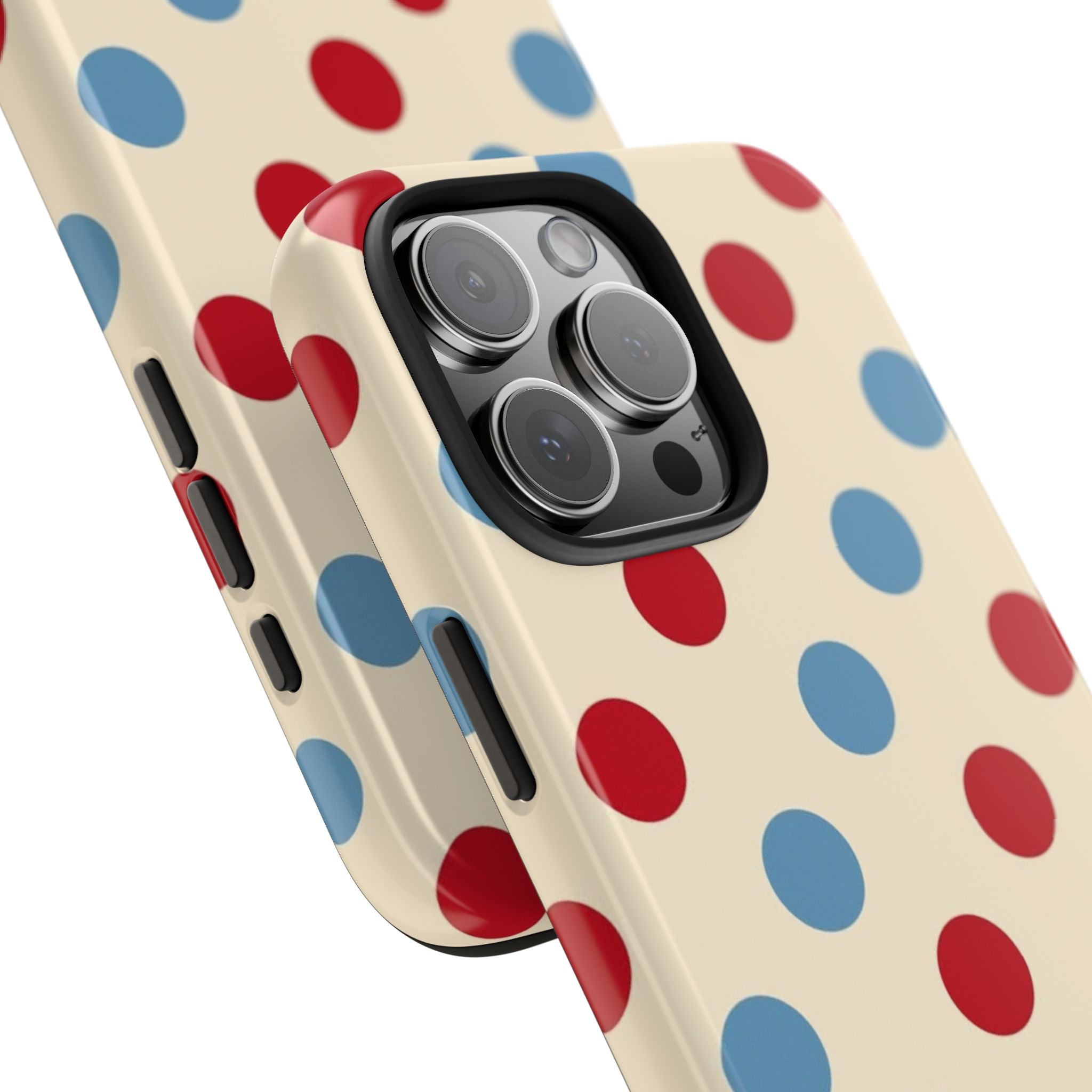 Close-up of cream polka dot phone case with red trim and raised camera rings