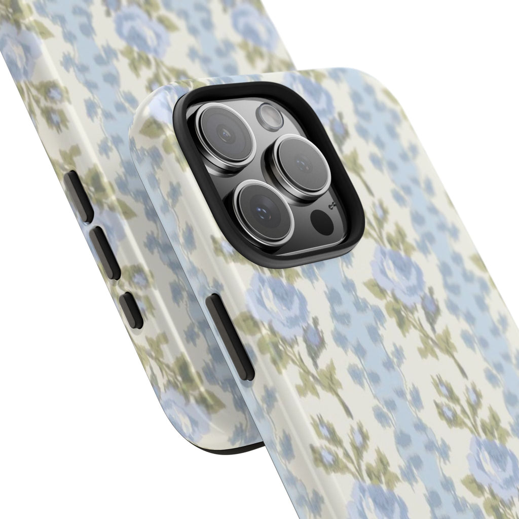 Blue rose floral phone case, angled view showing camera cutout and side buttons.