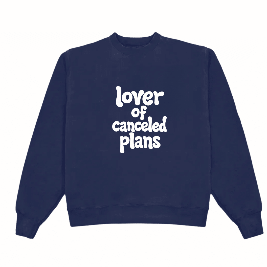 Navy crewneck sweatshirt with “Lover of canceled plans” graphic