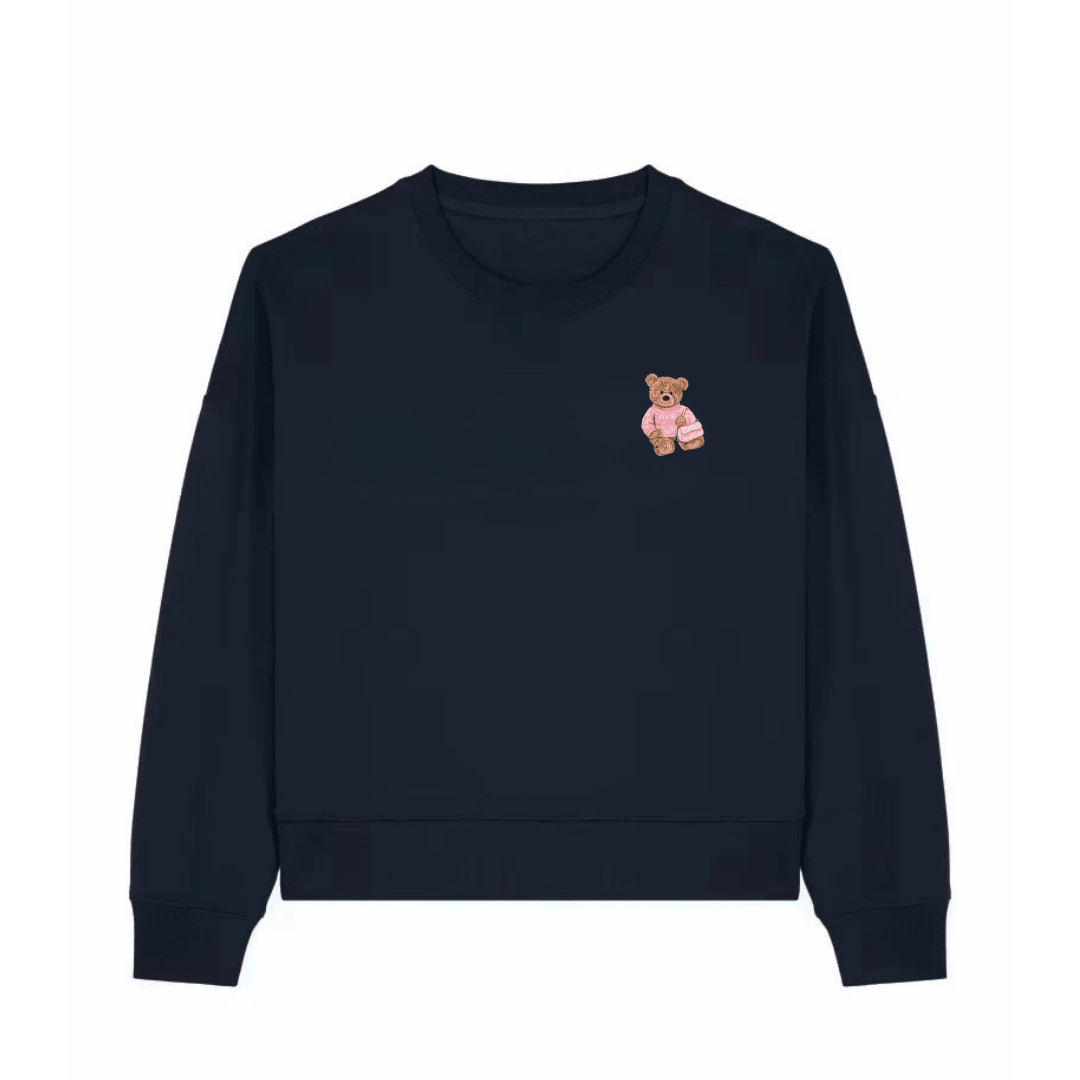 Navy blue crewneck sweatshirt with pink teddy bear graphic on left chest