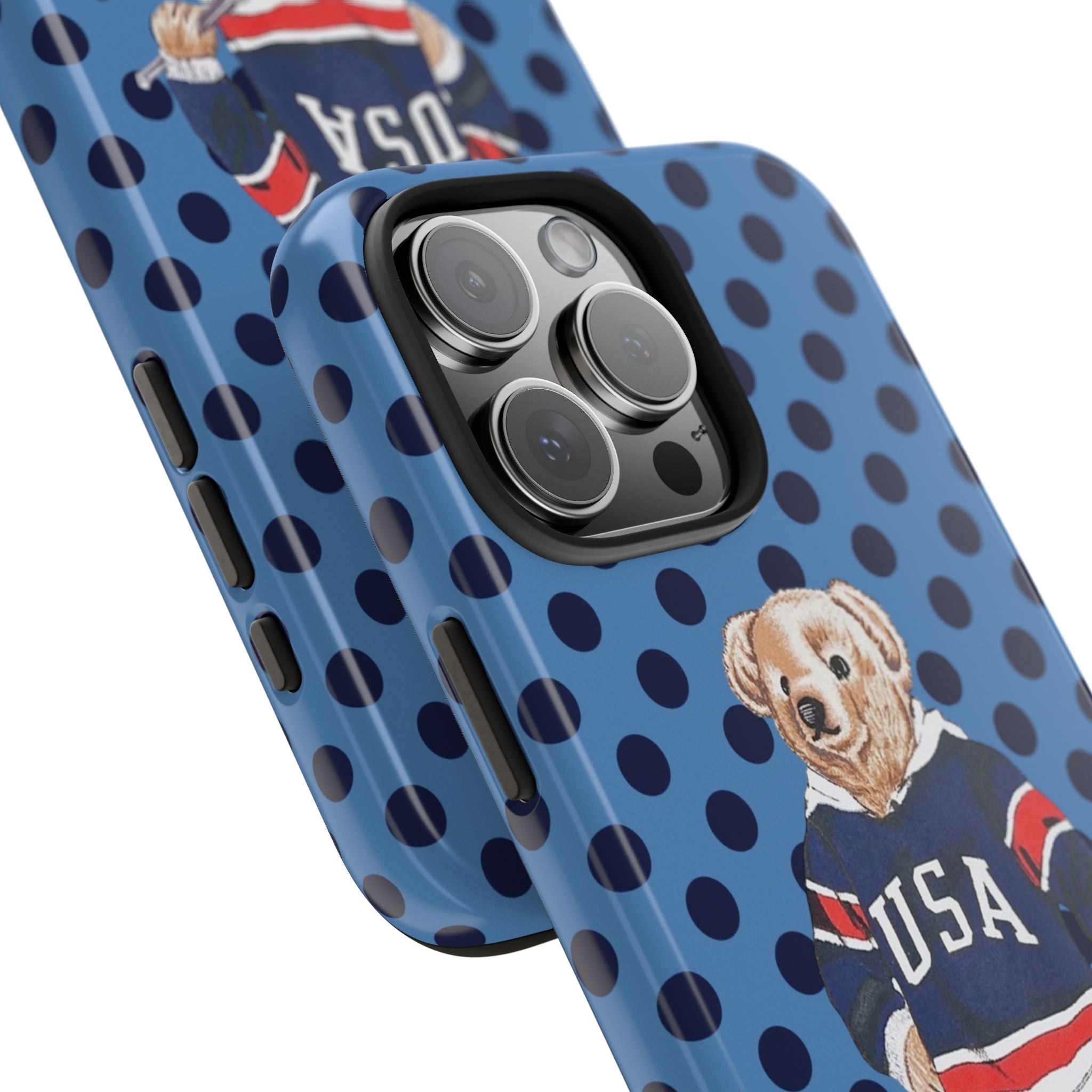 Blue polka dot phone case with teddy bear USA hockey jersey near camera cutout