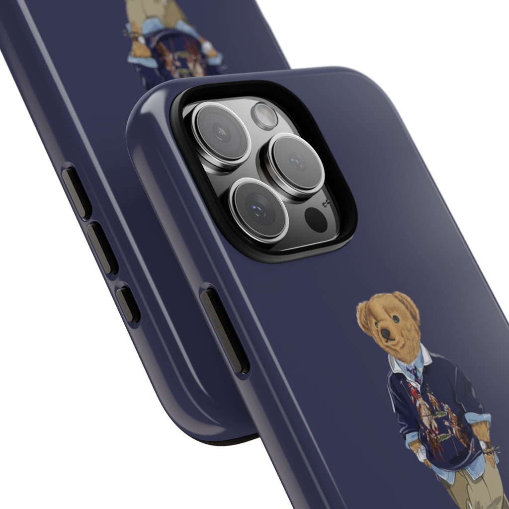 Close-up navy phone case showing camera rings, side buttons, and teddy bear patch