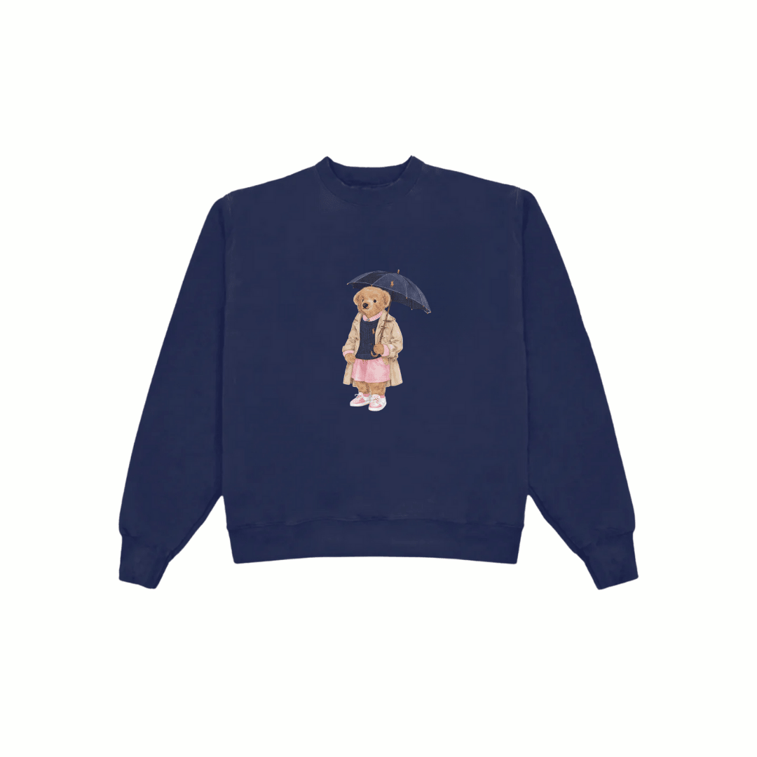 Navy blue crewneck sweatshirt with centered teddy bear under umbrella print