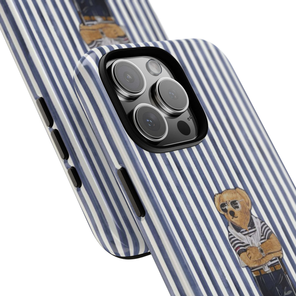 Blue-and-white striped case with teddy bear golfer motif on the side