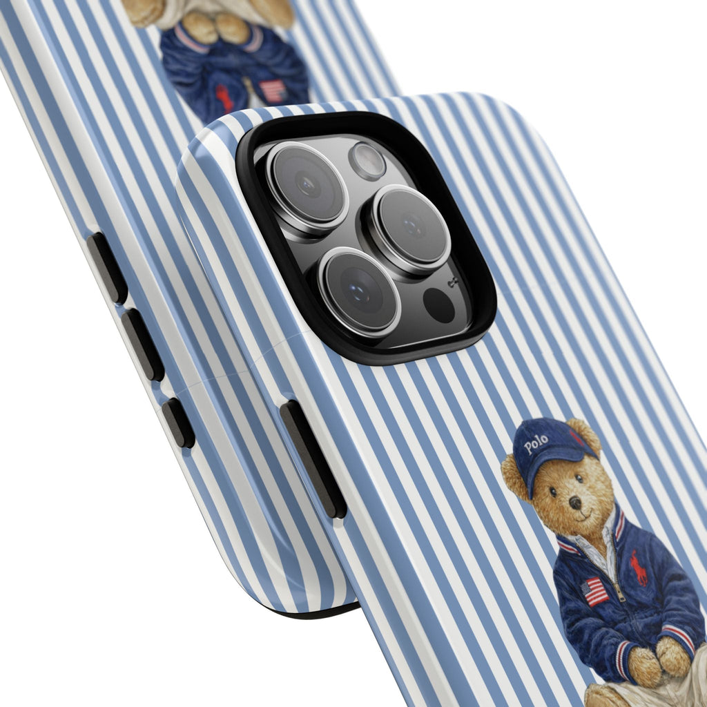 Blue-and-white striped case with teddy bear in navy polo and camera lens openings