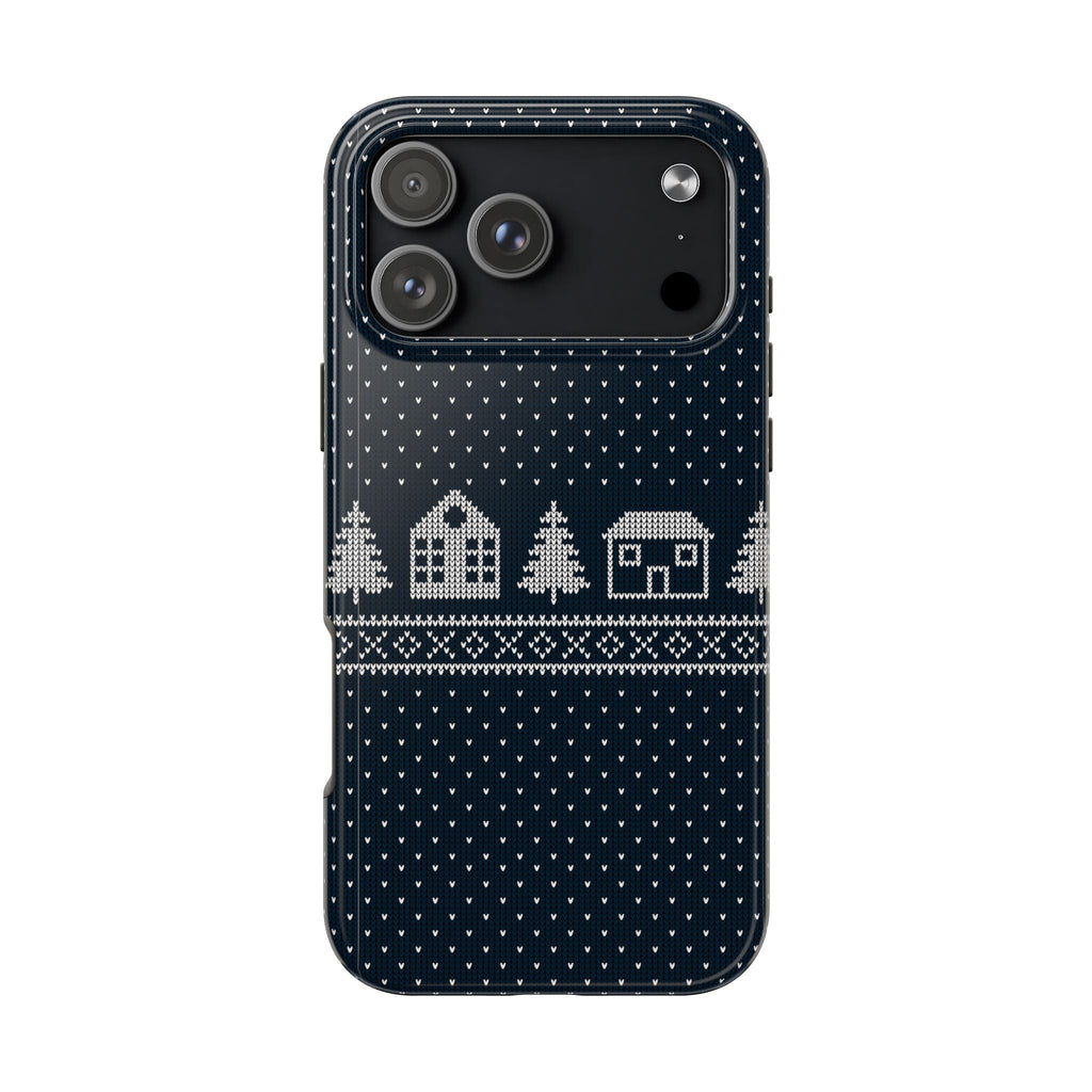 Navy winter knit phone case with white house and snowflake pattern, raised camera cutouts